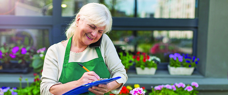 florist on the phone taking down an order