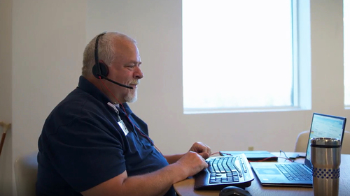 Nurse Advice Line registered nurse at laptop